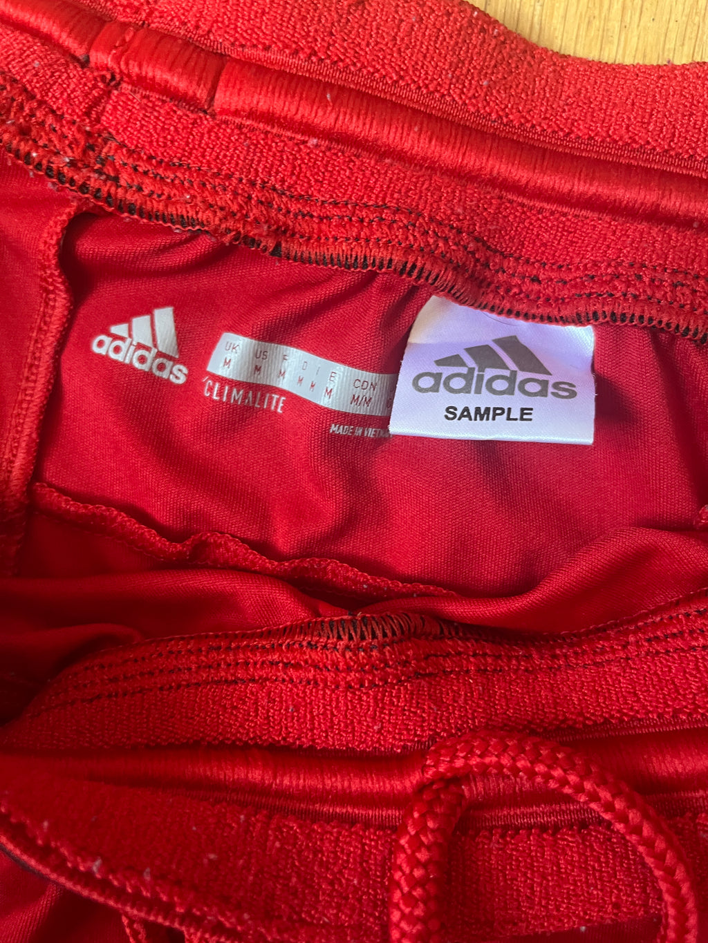 Adidas sample red medium item label photo